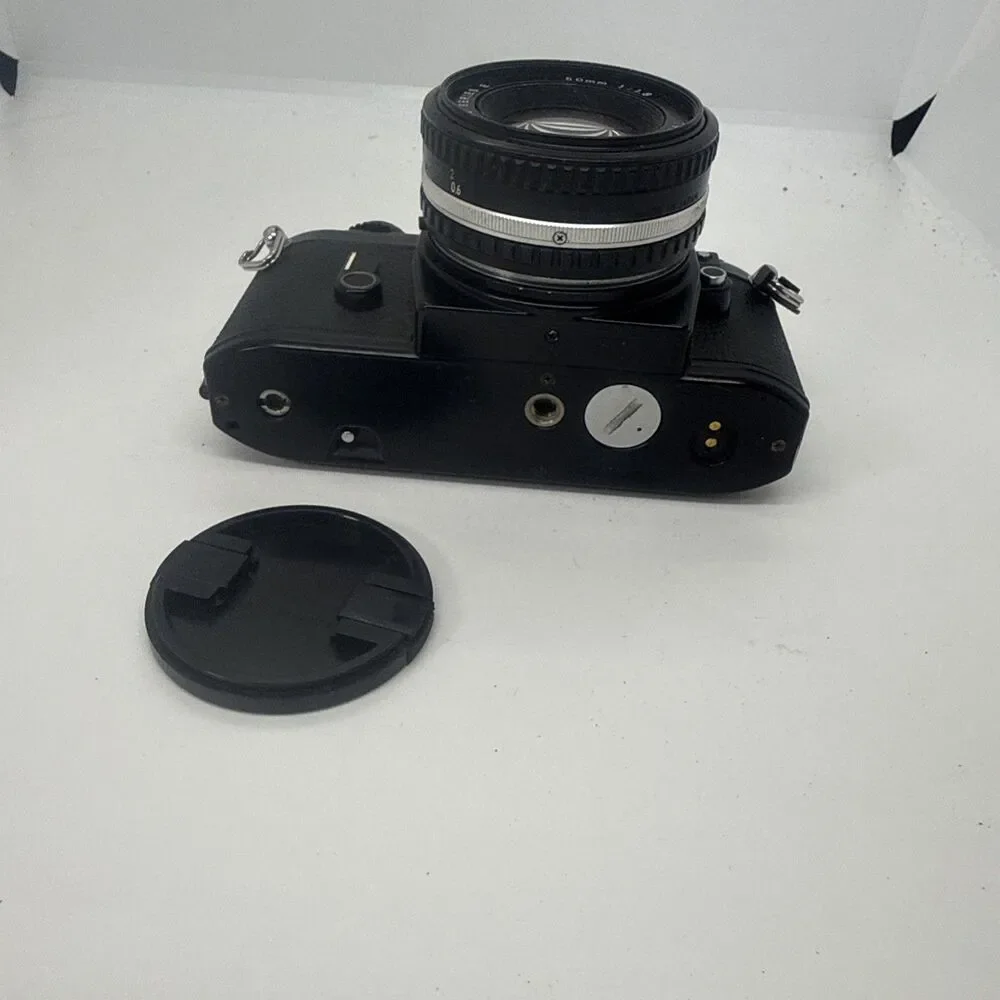 Vintage Nikon EM Black SLR Film Camera with Nikon Lens